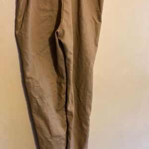 Tan pants zip up on the side